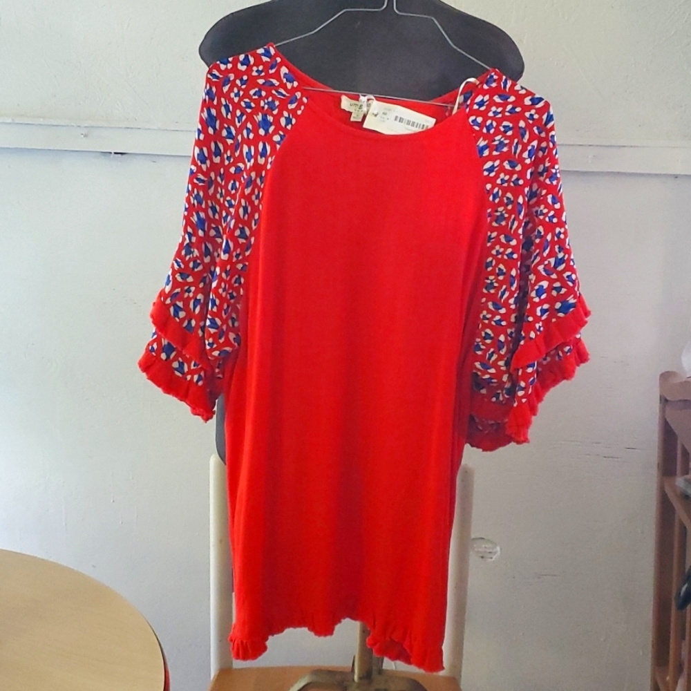 Red blouse with blue and white detailing